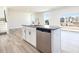 Open concept kitchen featuring a granite island, stainless steel appliances and lots of natural light at 425 Hipwood Dr, Zebulon, NC 27597