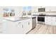 Open kitchen with a view of the neighborhood showcasing an island and stainless steel appliances at 425 Hipwood Dr, Zebulon, NC 27597