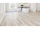 Open kitchen featuring white cabinets, a center island, and lots of space at 425 Hipwood Dr, Zebulon, NC 27597