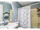 Bathroom featuring shower/tub, toilet, towel rack, sink and mirror at 428 Walton St, Durham, NC 27703