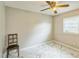Bedroom with a chair, a window with blinds and marble-look flooring at 428 Walton St, Durham, NC 27703