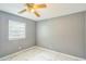 Bedroom features a window with blinds and marble-look floors at 428 Walton St, Durham, NC 27703
