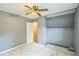 Bedroom with ceiling fan and open closet at 428 Walton St, Durham, NC 27703