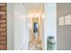 Hallway with closet, tile floors and view to rooms beyond at 428 Walton St, Durham, NC 27703