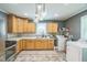 Bright kitchen featuring stainless steel appliances, ample counter space, and a convenient laundry area at 428 Walton St, Durham, NC 27703