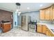 Updated kitchen featuring stainless steel appliances, ample counter space, and stylish flooring at 428 Walton St, Durham, NC 27703