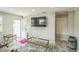 Comfortable living room featuring plush reclining furniture, a large-screen TV, and ample natural light at 428 Walton St, Durham, NC 27703