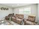 Comfortable living room featuring plush reclining furniture and ample natural light at 428 Walton St, Durham, NC 27703