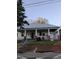 Charming bungalow with a covered front porch, brick foundation, and front yard at 431 Charles St, Henderson, NC 27536
