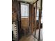 Living room with exposed interior wall structure and unfinished floors and walls at 431 Charles St, Henderson, NC 27536