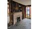 Living room with exposed brick chimney and unfinished walls at 431 Charles St, Henderson, NC 27536