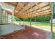 Covered back patio with brick flooring at 518 Buck Branch Dr, Garner, NC 27529