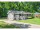 Charming home with gray siding, black shutters, and long driveway at 518 Buck Branch Dr, Garner, NC 27529