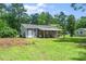 Rear exterior of home with covered patio and large backyard at 518 Buck Branch Dr, Garner, NC 27529