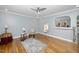 Living room with hardwood floors, ceiling fan, and decor at 518 Buck Branch Dr, Garner, NC 27529