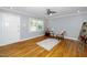 Living room with hardwood floors, ceiling fan, and decor at 518 Buck Branch Dr, Garner, NC 27529