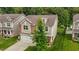 An elevated shot shows the manicured lawn and mature landscaping of this beautifully maintained property at 542 Spaulding St, Burlington, NC 27215