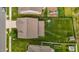 Birds-eye view of backyard with lush lawn, swing set, privacy fence, and neighboring homes at 542 Spaulding St, Burlington, NC 27215