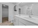 Bathroom with dual sinks, tiled floors, and walk-in shower at 542 Spaulding St, Burlington, NC 27215