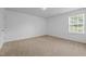 Bedroom with plush neutral carpet and natural light at 542 Spaulding St, Burlington, NC 27215