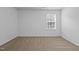 Bedroom featuring neutral walls and carpet and large window at 542 Spaulding St, Burlington, NC 27215