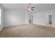 Bedroom with plush carpeting and ceiling fan at 542 Spaulding St, Burlington, NC 27215