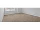 Bright bedroom showcasing neutral carpet, window, and natural light, great for relaxing at 542 Spaulding St, Burlington, NC 27215