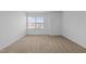 Bedroom featuring neutral walls and carpet and large window at 542 Spaulding St, Burlington, NC 27215