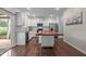 Bright kitchen with white cabinets, stainless appliances, and a wood-topped island at 542 Spaulding St, Burlington, NC 27215
