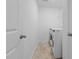 Bright laundry room with tile floors and modern washer and dryer units offers convenience at 542 Spaulding St, Burlington, NC 27215