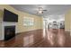 Open living area featuring fireplace and view into kitchen with stainless appliances at 542 Spaulding St, Burlington, NC 27215
