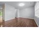 Spacious living room featuring beautiful hardwood floors, ample natural light and neutral color scheme at 542 Spaulding St, Burlington, NC 27215