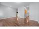 Spacious living room with hardwood floors, neutral walls, and open layout to adjacent rooms at 542 Spaulding St, Burlington, NC 27215