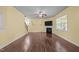 Spacious living room with wood floors, a fireplace, and plenty of natural light at 542 Spaulding St, Burlington, NC 27215