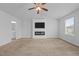 Large main bedroom with television, fireplace, ceiling fan, and large windows at 542 Spaulding St, Burlington, NC 27215
