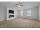 Spacious main bedroom features a decorative fireplace, large television and natural light at 542 Spaulding St, Burlington, NC 27215