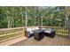 Outdoor living space featuring a back deck with an outdoor seating area at 5550 Mountain Trl, Snow Camp, NC 27349