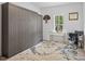 Versatile bedroom with a built-in Murphy bed, desk area, and modern decor, ideal for a guest room or office at 5550 Mountain Trl, Snow Camp, NC 27349