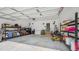 Spacious garage with shelving units and plenty of room for storage and equipment at 5550 Mountain Trl, Snow Camp, NC 27349