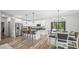 Modern kitchen with stainless steel appliances, granite countertops, and an island with barstool seating at 5550 Mountain Trl, Snow Camp, NC 27349