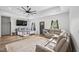 Spacious living room featuring hardwood floors, vaulted ceilings, ample seating, and natural light at 5550 Mountain Trl, Snow Camp, NC 27349