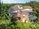Backyard aerial showcasing a screened porch and spacious outdoor entertaining area at 5768 Cavanaugh Dr, Raleigh, NC 27614