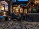 Large stone patio featuring a built-in grill, dining area, and lounge space for relaxing and entertaining at 5768 Cavanaugh Dr, Raleigh, NC 27614