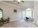 Spacious bedroom with carpet, large windows, a desk, a ceiling fan, and great natural light at 5768 Cavanaugh Dr, Raleigh, NC 27614