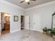 Neutral bedroom with carpet, ceiling fan, and doorway access to an en-suite bathroom at 5768 Cavanaugh Dr, Raleigh, NC 27614