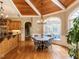 Bright dining area with wood-paneled ceiling, large windows, and a stylish table with seating for four at 5768 Cavanaugh Dr, Raleigh, NC 27614