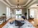 Formal dining room featuring a long wooden table and decorative chandelier and views to other rooms at 5768 Cavanaugh Dr, Raleigh, NC 27614