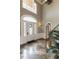 Grand foyer featuring marble floors, high ceilings, and an arched doorway with a chandelier at 5768 Cavanaugh Dr, Raleigh, NC 27614