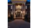 Elegant brick home featuring a grand entrance with stately columns and a manicured lawn, radiating curb appeal and sophistication at 5768 Cavanaugh Dr, Raleigh, NC 27614