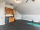 Bonus room with a kitchenette, custom cabinets, and vaulted ceilings at 5768 Cavanaugh Dr, Raleigh, NC 27614